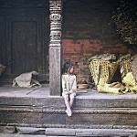 Little girl sitting on steps