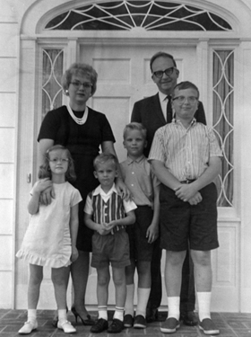 President Whiddon with wife and children on front porch.