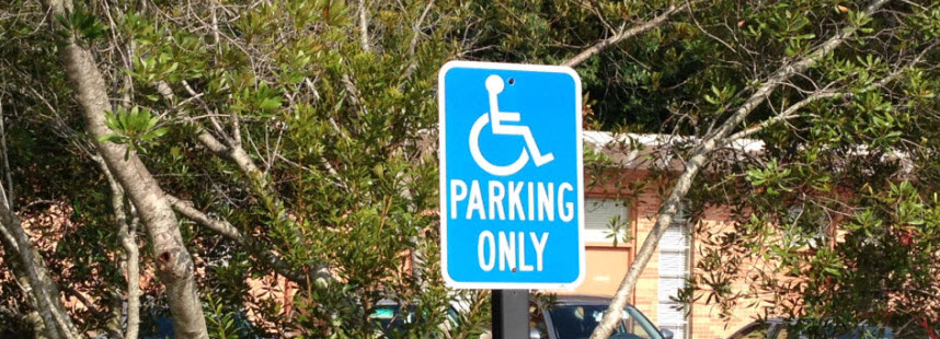 Handicap parking sign in parking lot