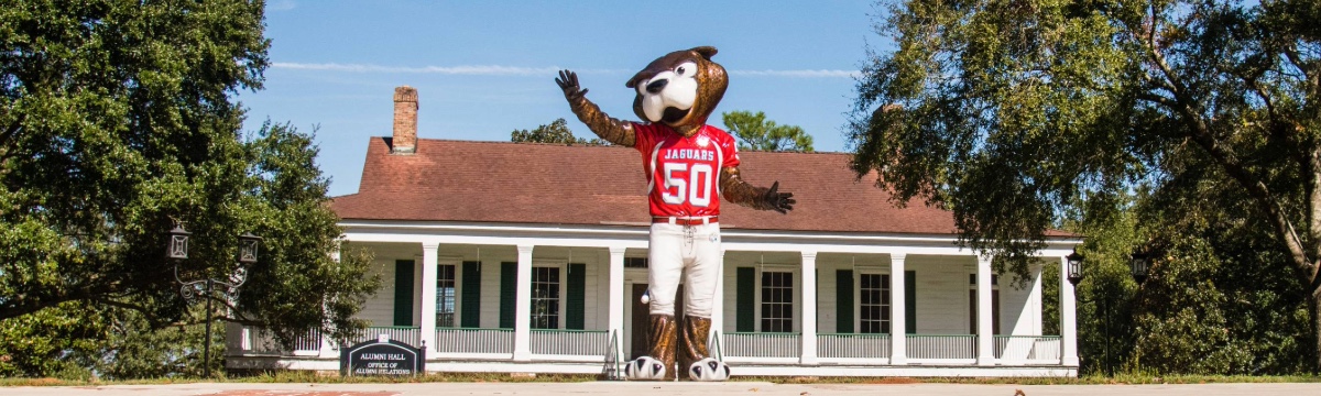 Statue of South Paw in front of the Toulmin House on USA's campus